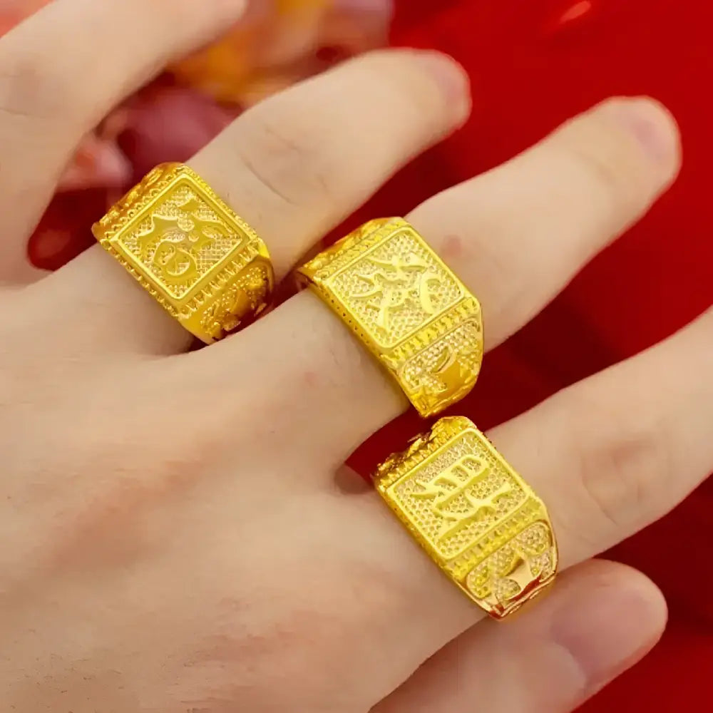 Three gold rings with Chinese characters.