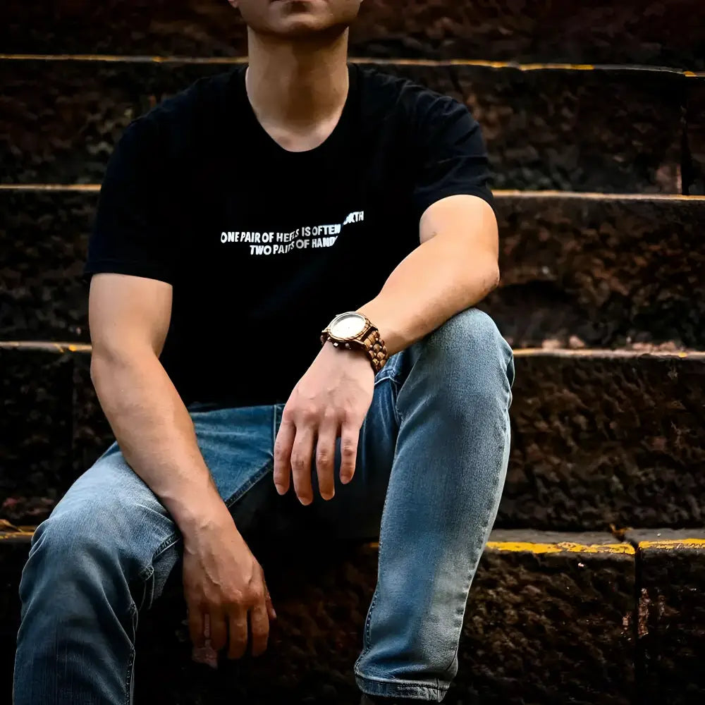 Man wearing a black t-shirt paired with BOBO BIRD wooden white face chronograph watch