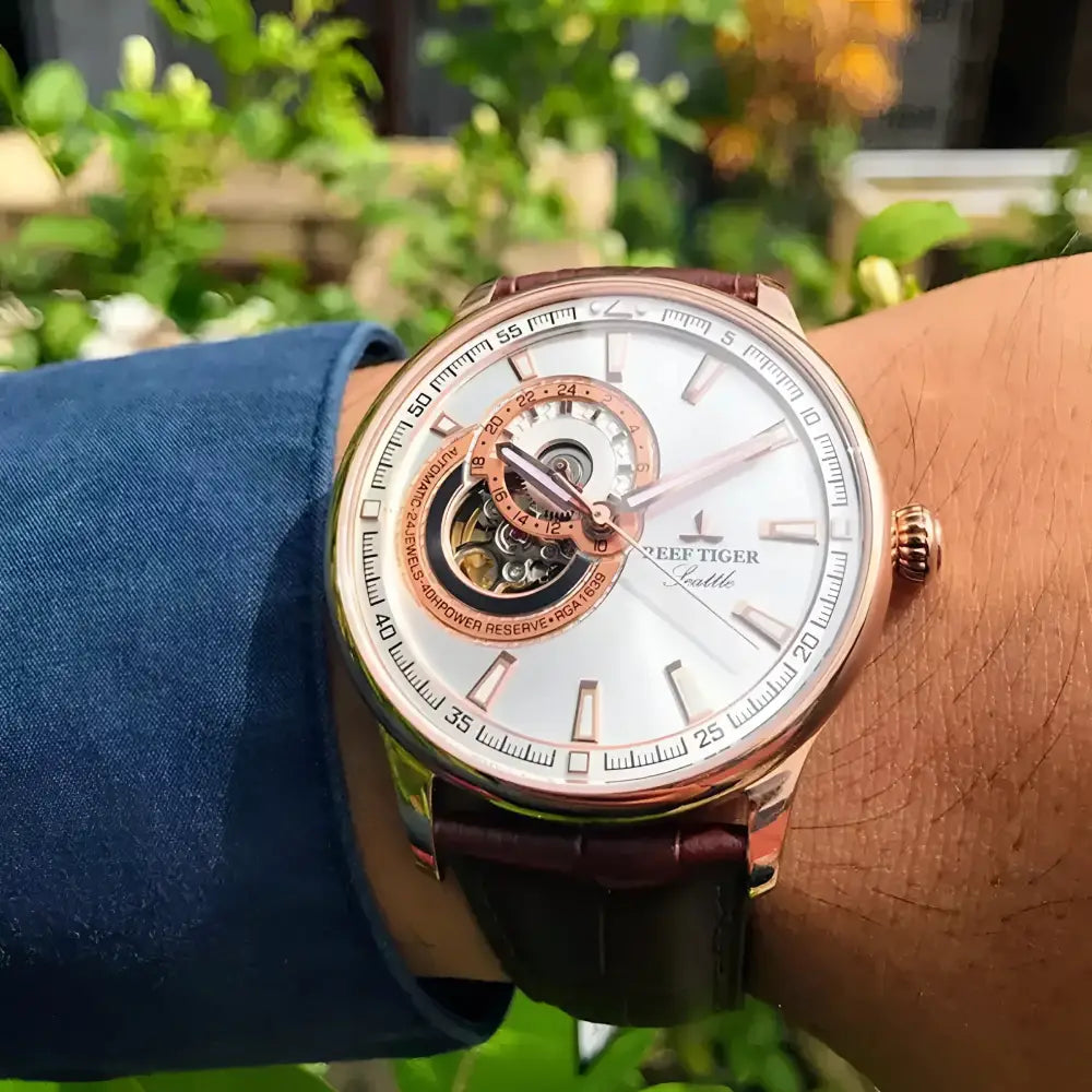 Rose gold automatic wristwatch from Reef Tiger watches with brown leather jewelry accessories