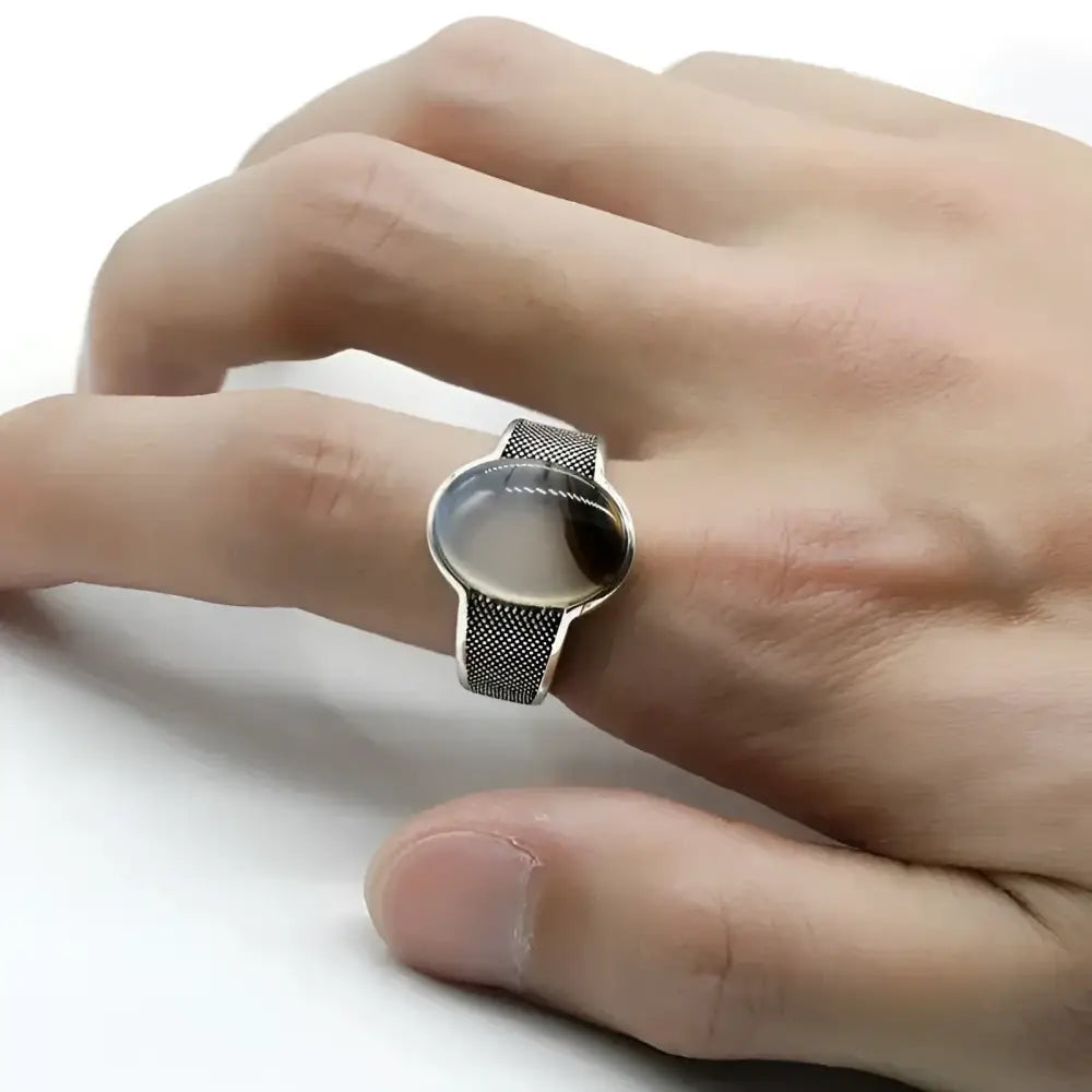 Silver ring with oval stone.