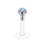 Labret piercing with opal cabochon.