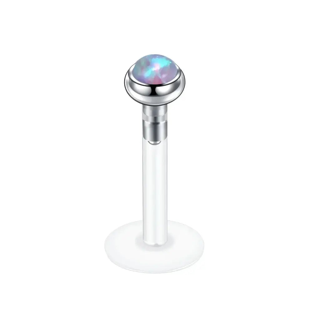 Labret piercing with opal cabochon.