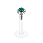 Labret piercing with iridescent stone.