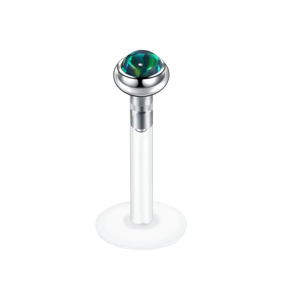 Labret piercing with iridescent stone.