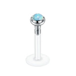 Labret piercing with opal.