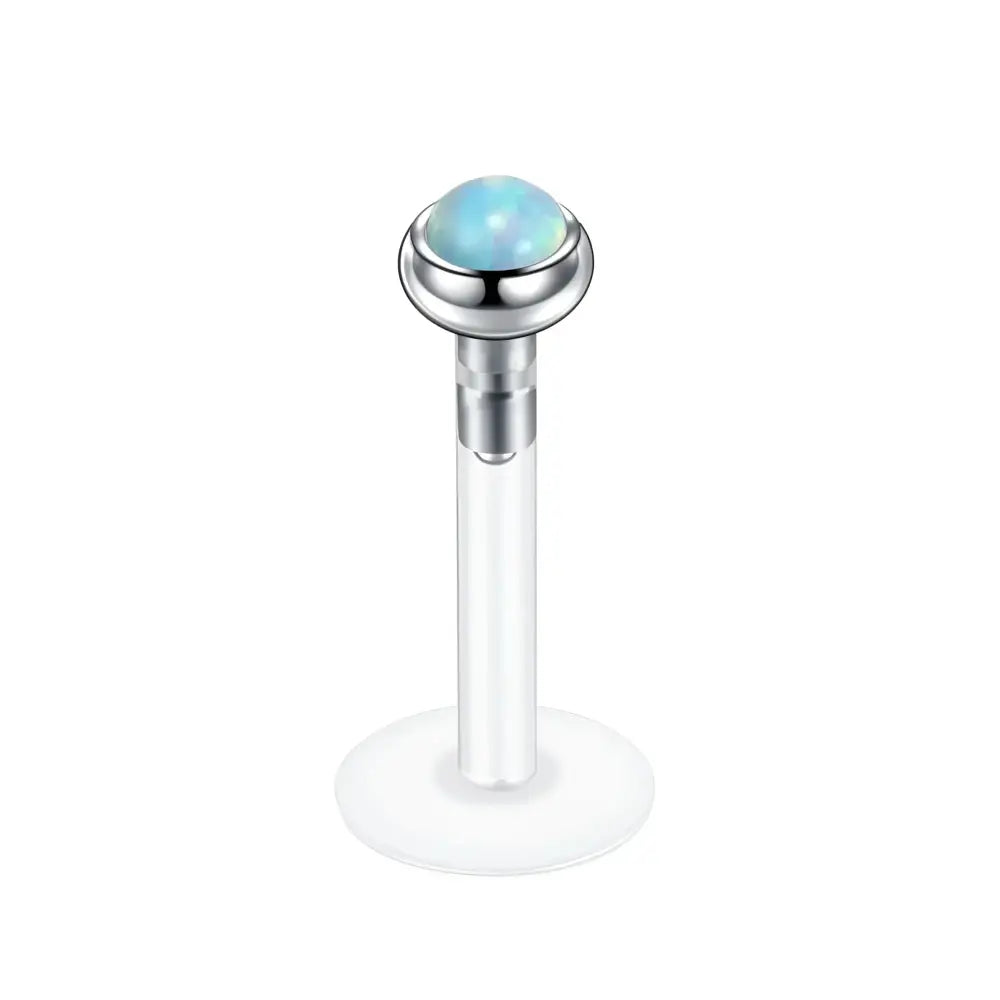 Labret piercing with opal.