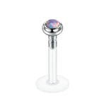 Opal-topped labret piercing.
