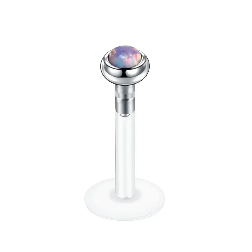 Opal-topped labret piercing.