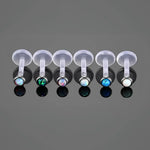 Labret piercings with opal beads.