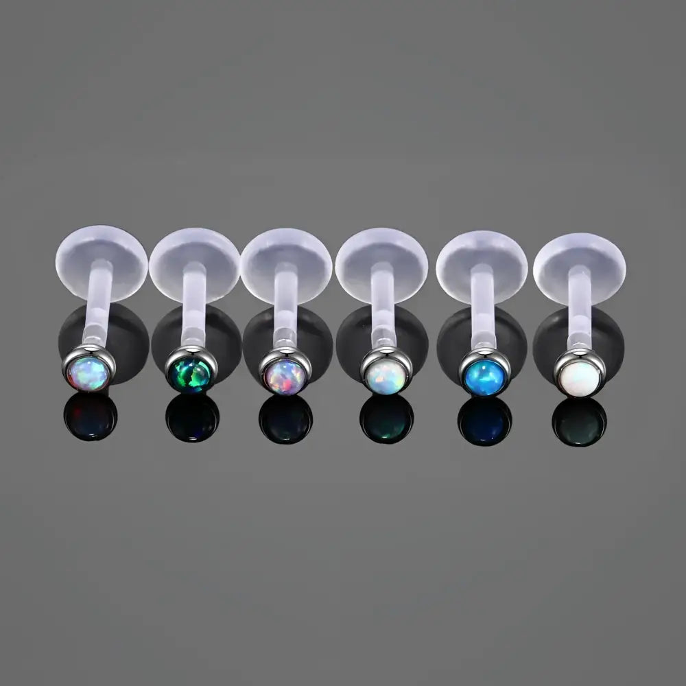 Labret piercings with opal beads.