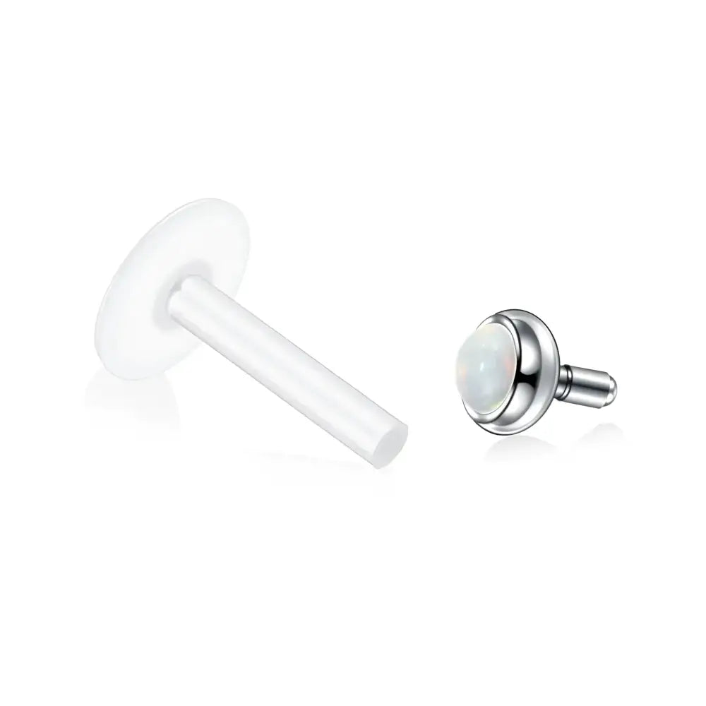 Two-piece labret piercing with opal.