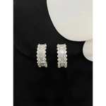 Sparkling diamond hoop earrings.