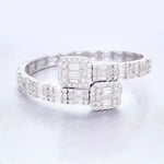 Diamond-encrusted silver bracelet with square accents.
