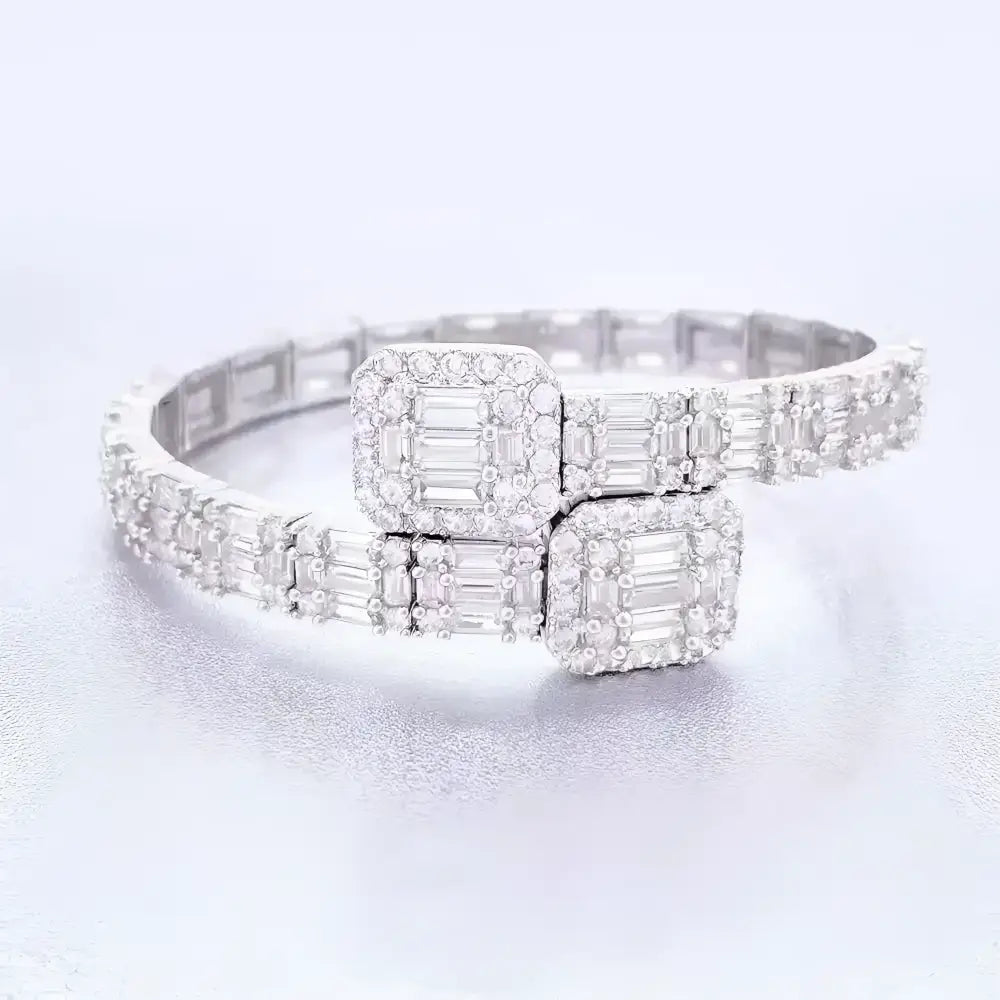Diamond-encrusted silver bracelet with square accents.