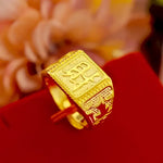 Gold ring with a rectangular face.