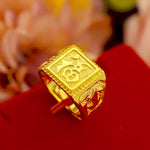 Gold ring with a square face.