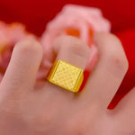 Gold square signet ring.