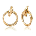 Pair of gold hoop earrings.
