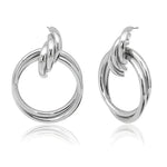 Silver triple-hoop earrings.