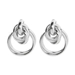 Pair of silver knot earrings.