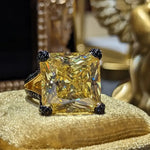 Yellow square-cut gemstone ring.