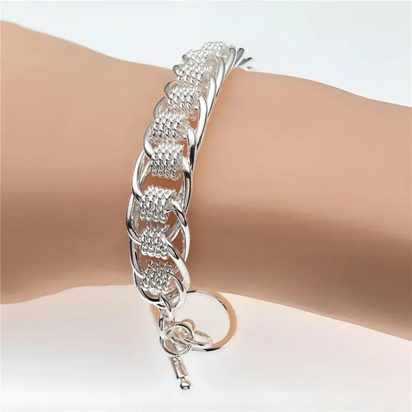 Silver chain-link bracelet.
