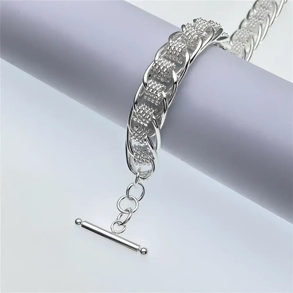 Silver chain bracelet with toggle clasp.