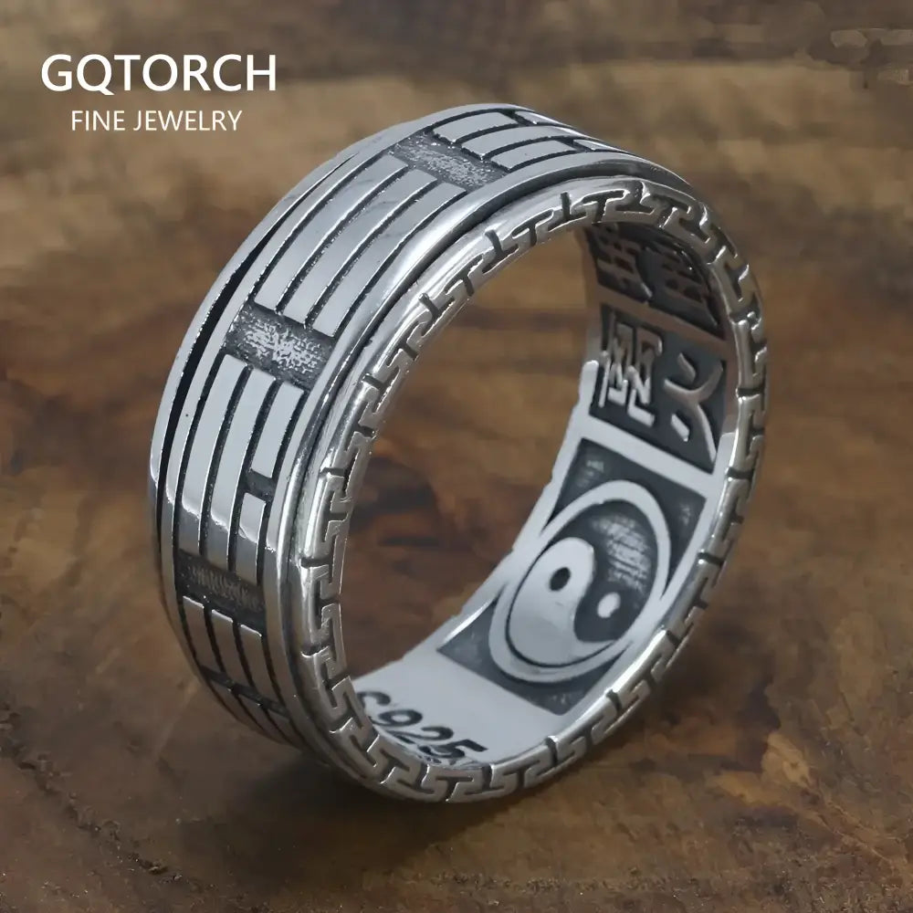Silver ring with yin-yang symbol.