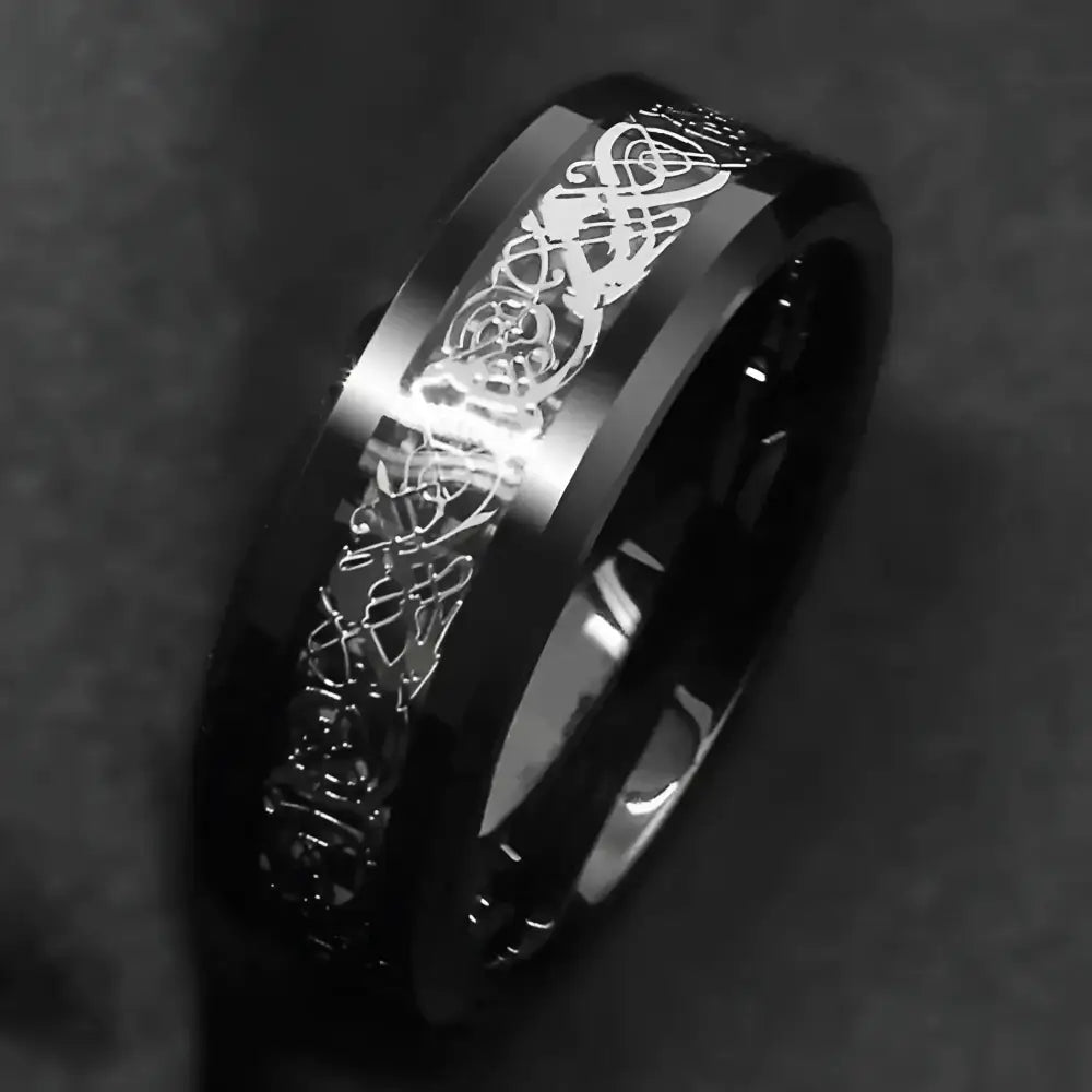 Black tungsten ring with Celtic dragon design.