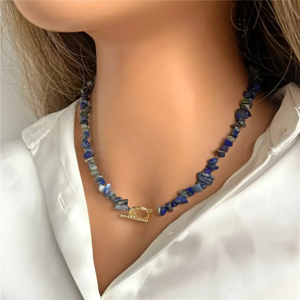 Lapis lazuli chip necklace with gold clasp.