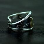 Ornate silver ring.