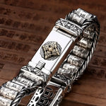 Ornate silver bracelet.