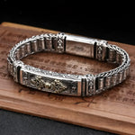 Ornate silver bracelet.