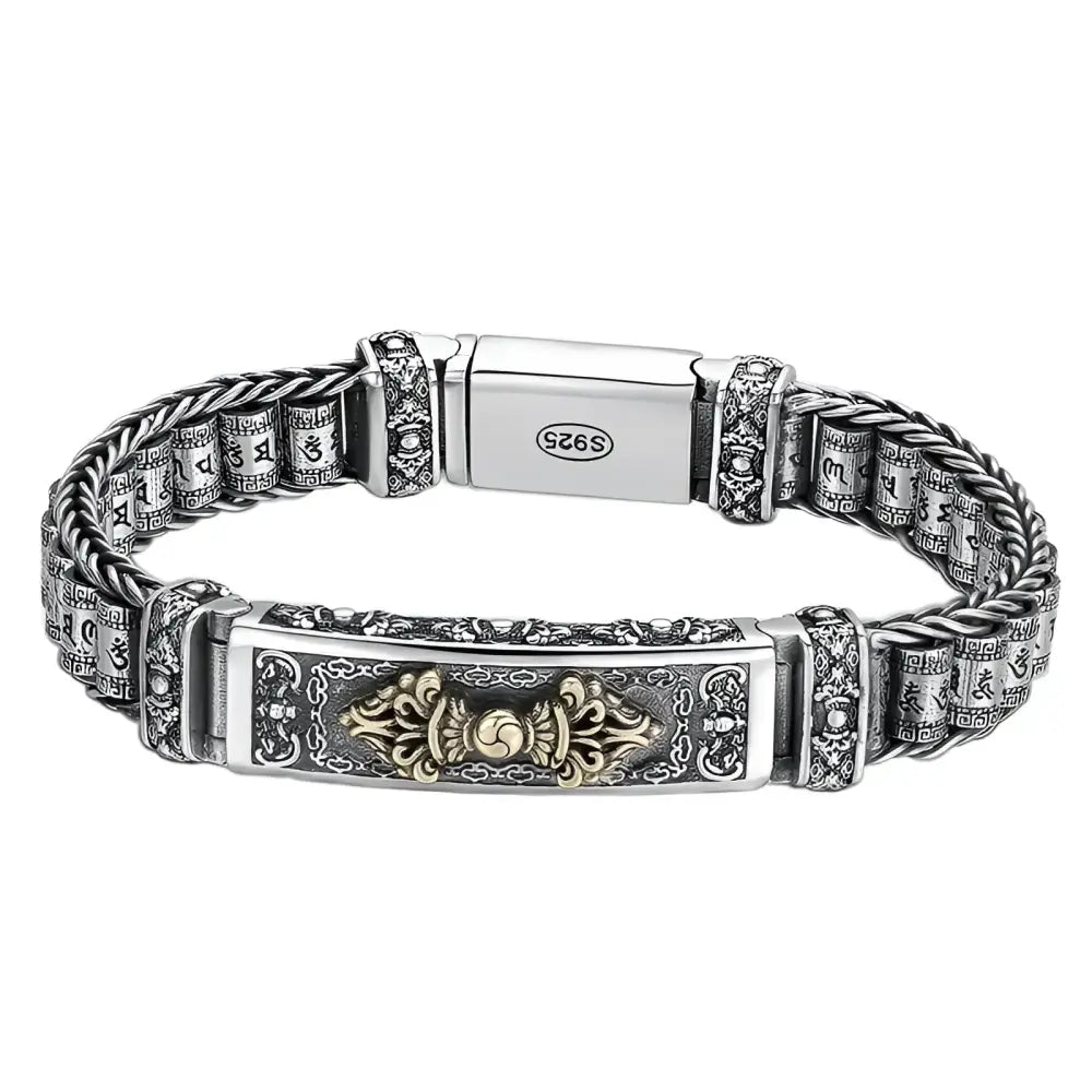 Silver bracelet with ornate details.