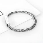 Silver chain bracelet with clasp.