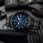 Black and blue chronograph watch displayed as a Casio silver chronograph business accessories
