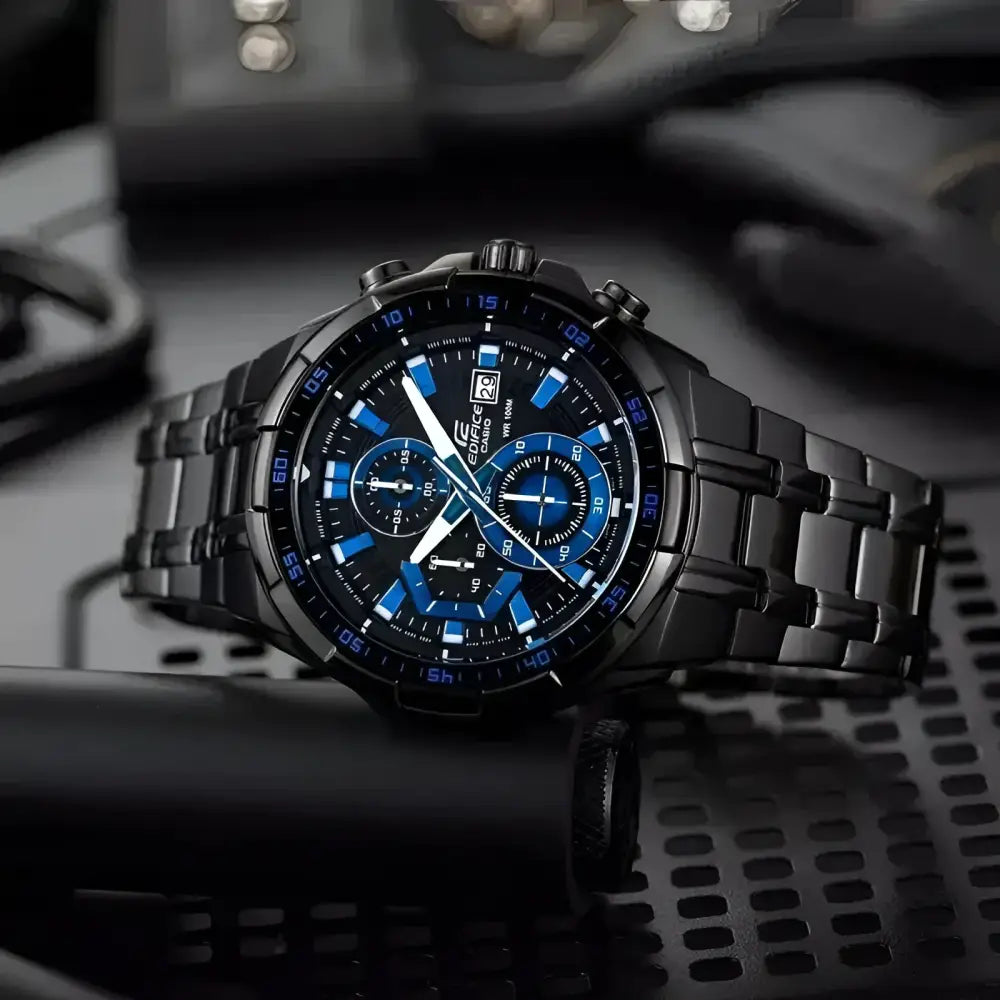 Black and blue chronograph watch displayed as a Casio silver chronograph business accessories