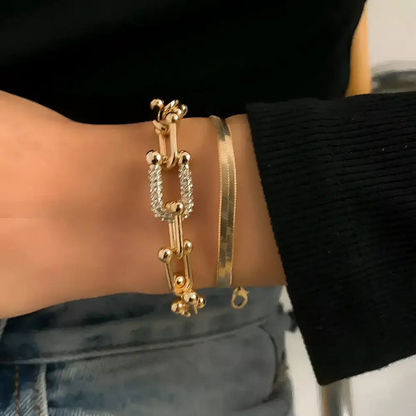 Gold-toned bracelets.