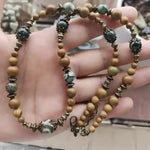 Beaded necklace with decorative accents.