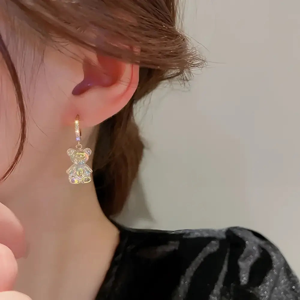 Sparkly teddy bear earring.