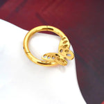 Gold-toned butterfly hinged segment ring.