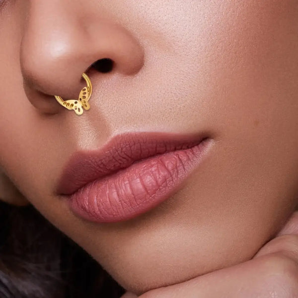 Gold butterfly septum ring.