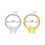 Silver and gold butterfly septum rings.