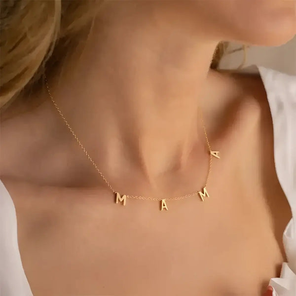 Gold ’MAMA’ necklace.