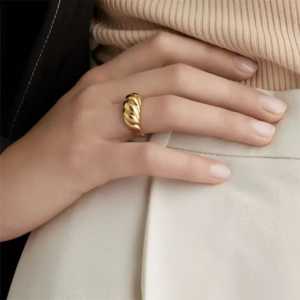 Gold croissant-shaped ring.