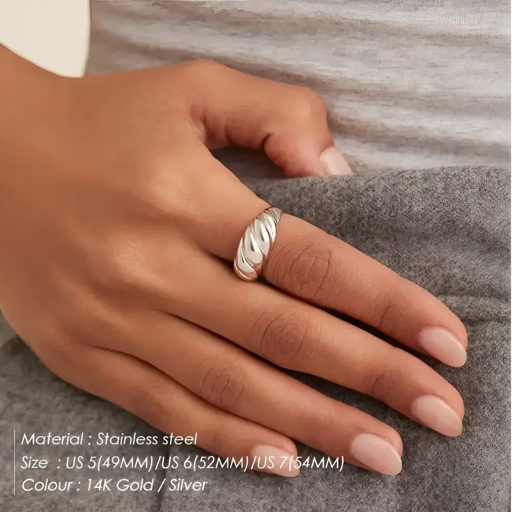 Silver croissant-shaped ring.