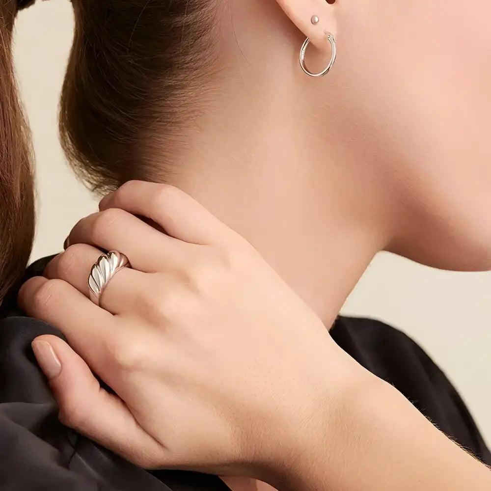 Silver croissant ring.