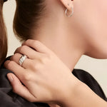 Silver croissant-shaped ring.