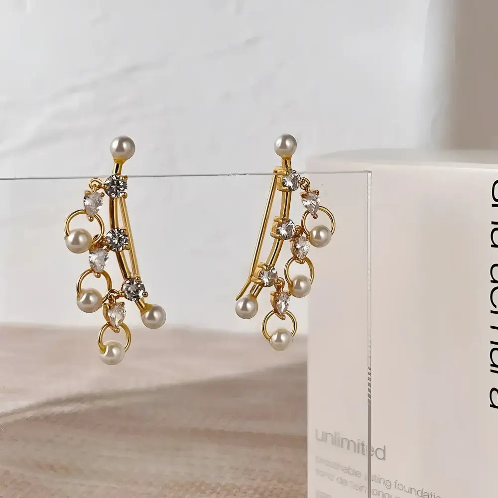 Pearl and crystal drop earrings.