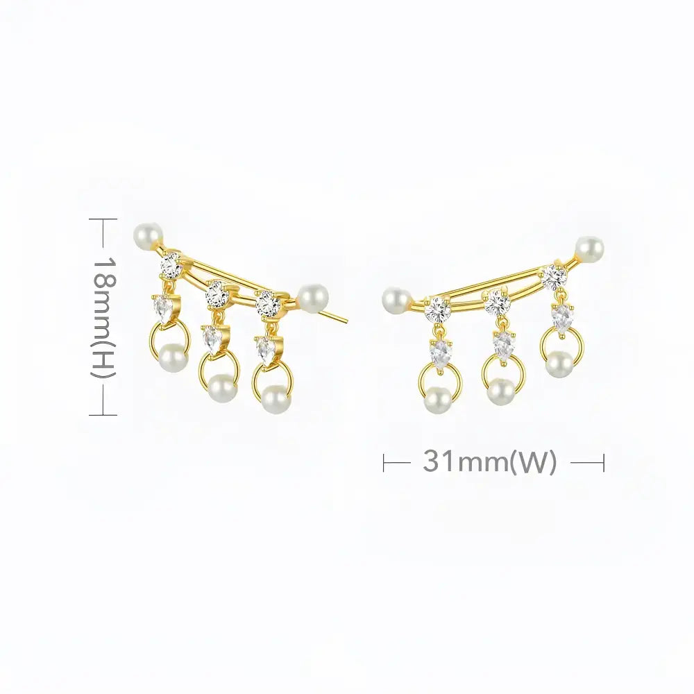 Gold pearl and crystal earrings.